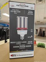 Front of box showing lamp specifications: 63/80/100 watts power select, replaces 400W metal halide, EX39 mogul base, 8820/11200/14000 lumens, color temperature 3000K/4000K/5000K