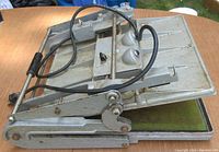 Front angle view of Seal Inc. Jumbo 150 heat press showing metal frame and heating element wiring.