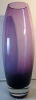 Front view of tall purple glass vase showing ombre color effect and smooth surface