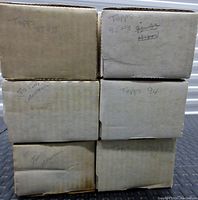 Six labeled cardboard boxes stacked, showing years 1987-1996 for Topps baseball cards.