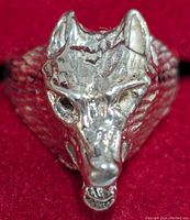 Front view of the silver wolf head ring showing the detailed facial features and texture.