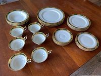 Full lot arranged on table showing plates, bowls, cups and saucers
