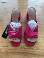 Top view of the pink heels showing the twisted knot strap and square toe shape.