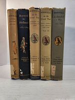 Five hardcover books by James Boswell with varied dust jackets, showing titles and edition details.