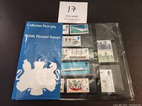 Photo of the unopened blue British Pictorial Stamps 1969 collectors pack with visible stamps arranged inside pocket pages.