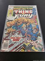 Photograph of the front cover of Marvel Two-In-One #26 comic book featuring The Thing and Nick Fury from 1977.