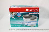 Boxed Honeywell Cool Moisture Humidifier showing product image, branding, and highlight of easy top fill design.