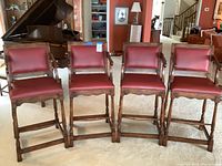 Front view of four bar stools in a row