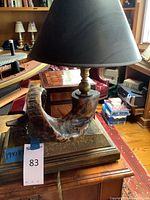 Front view of lamp showing shade, horns and base