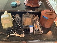 Wide view of all lot items on counter including the ice crusher, planter, bar tools, and ice bucket