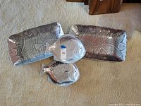 Three sea themed serving dishes shown, including two rectangular fish pattern trays and two fish-shaped dishes with hammered texture.