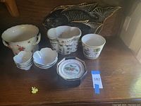 Black carved wooden fish-shaped tray leaning at back