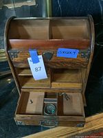 Box open showing top three cubbies, bottom pull-out drawer with three compartments, removable green glass inkwell liner and two keys
