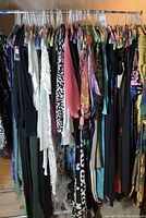 Rack of mixed women’s size small garments on hangers