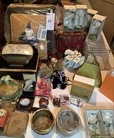 Overview of the lot with various trinket boxes, figurines, decorative pillows, and ceramic pieces.