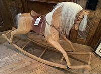 Full side view of the wooden rocking horse