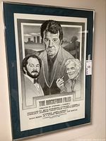 Framed black-and-white illustrated promotional poster for The Rockford Files with blue mat and silver frame