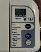 Close-up of the control panel on Sunbeam bread maker showing timer set, 8 baking modes and function buttons.