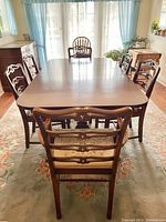Full set of mahogany table and six chairs in dining room setting