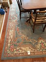 Full view of rug under dining table showing overall pattern and size