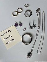 Overall view of all jewelry items arranged on surface