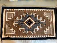 Full view of tapestry rug laid flat