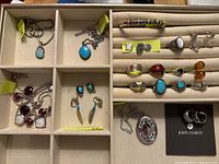 Tray of rings, studs and pendants in front compartments