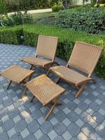 Angled front view showing two folding chairs and two ottomans arranged on patio pavers.