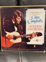 Front cover of the box set showing Glen Campbell playing guitar with title 'Glen Campbell's Golden Favorites'.