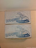 Photo of two original boxes labeled 'Beachcomber seafood set' by Federal Glass Co.