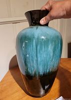 Front view of the Blue Mountain Pottery vase showing color gradient from blue to black glaze with DRIP effect and glossy finish.