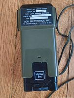 Front view showing model number, serial number, manufacturing date, and manufacturer details from ACR Electronics, Inc, made in August 2005.