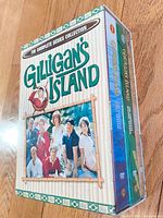 Collector's slipcover for Gilligan's Island Complete Series Collection with cast photo.