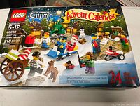 Front of Lego City Advent Calendar 60063 box with image of set and details on packaging