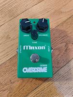 Top view of green Maxon OD808 Overdrive guitar pedal showing control knobs and footswitch.