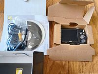 Nikon Coolpix S3000 camera, software CD, USB and AV cables, and manuals in original packaging.