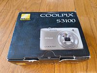 Closed original Nikon Coolpix S3100 box showing the front with camera image and branding.