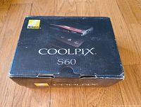 Box for Nikon Coolpix S60 camera showing original packaging with image of the camera on top and Nikon branding