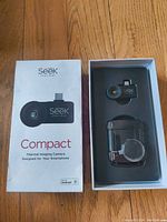 Packaging showing the front box indicating the product is a Seek Thermal Compact Thermal Imaging Camera designed for Android smartphones, with the thermal camera and waterproof case inside the foam insert.