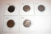 Five Canada Large Cents obverse side showing portraits of Queen Victoria and King George V in 2x2 holders with year labels 1876H, 1888, 1901, 1917, and 1919.