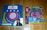 Photo of Stitch Studio round loom set box and Rainbow Loom box showing packaging and sizes.