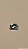 Pear cut sky blue topaz gemstone, 1.41 carat, displayed against a neutral background showing clarity and color.