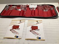 12-piece garnishing tool set in red pouch with use and care instructions displayed