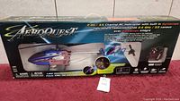 Box of AreoQuest 2.4G 3.5 Channel R/C Helicopter showing helicopter image, brand and product features.