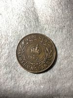 Reverse side of the 1907 Newfoundland one cent coin showing crown, date, and inscription.
