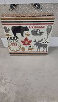 Front view of the 14x14 inch Oh Canada poster showing Canadian wildlife and iconic symbols.
