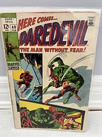 Front cover of Daredevil #49 comic book featuring Daredevil and Gladiator with vibrant colors and clear issue details.