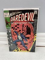 Daredevil #51 comic book front cover showing Daredevil in action, bagged and boarded.