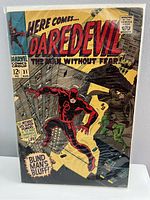 Photo of Daredevil comic book issue 31 in protective bag and board showing front cover art and condition