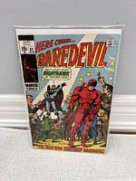Front cover photo of Daredevil Comic #62 showing Daredevil in red suit, Night Hawk and others, with issue and pricing details visible